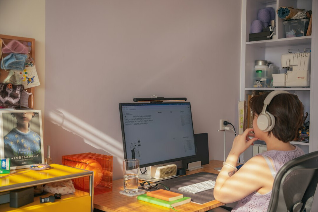 student studying coding at home desk