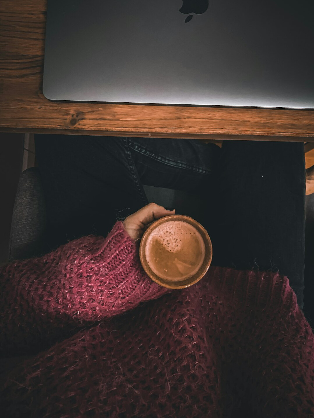 person relaxing with tea after coding