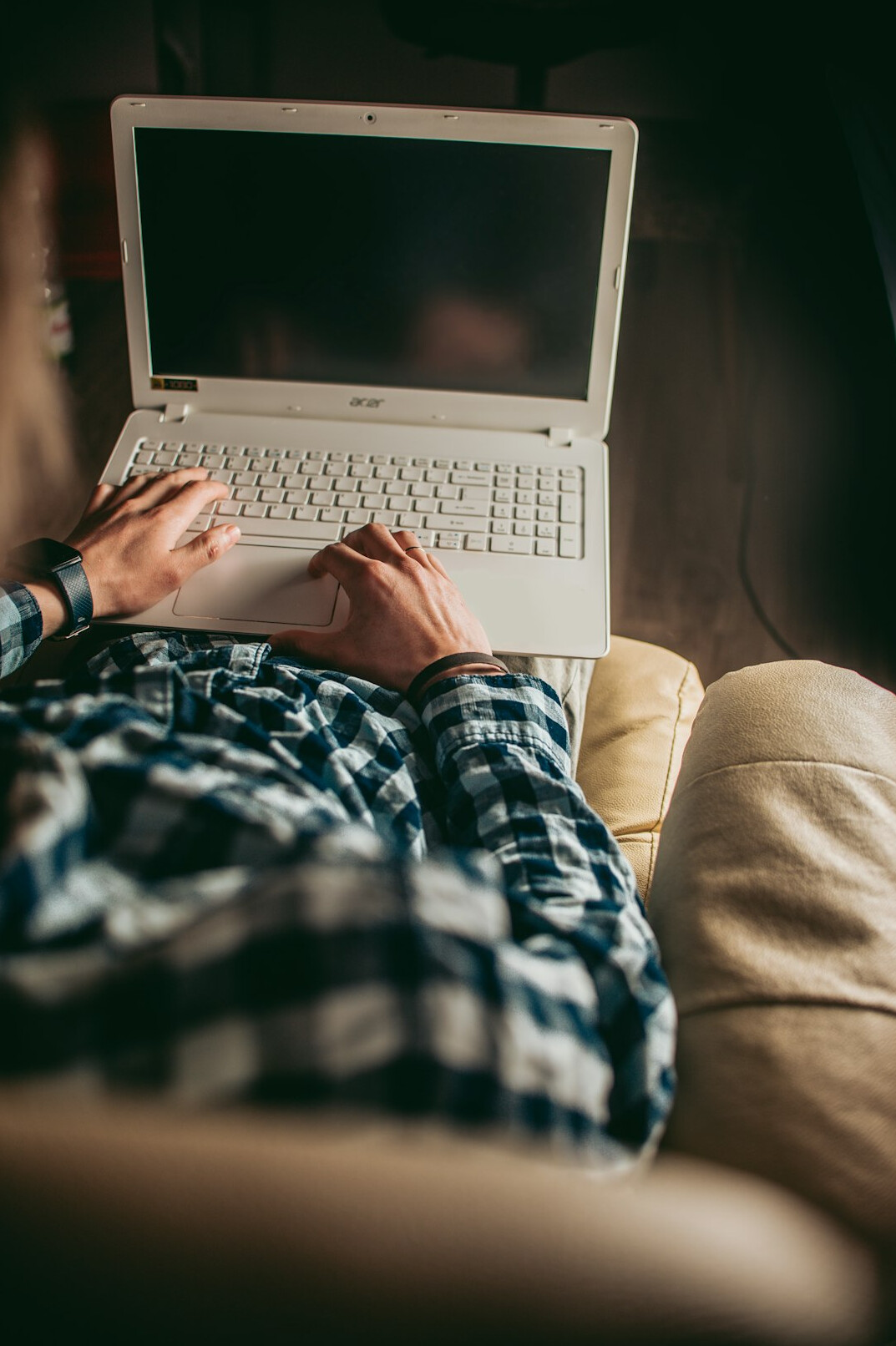 person coding comfortably at home
