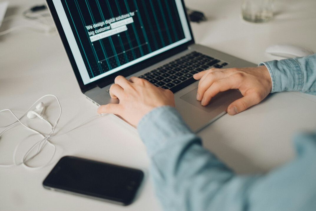 person learning coding on laptop