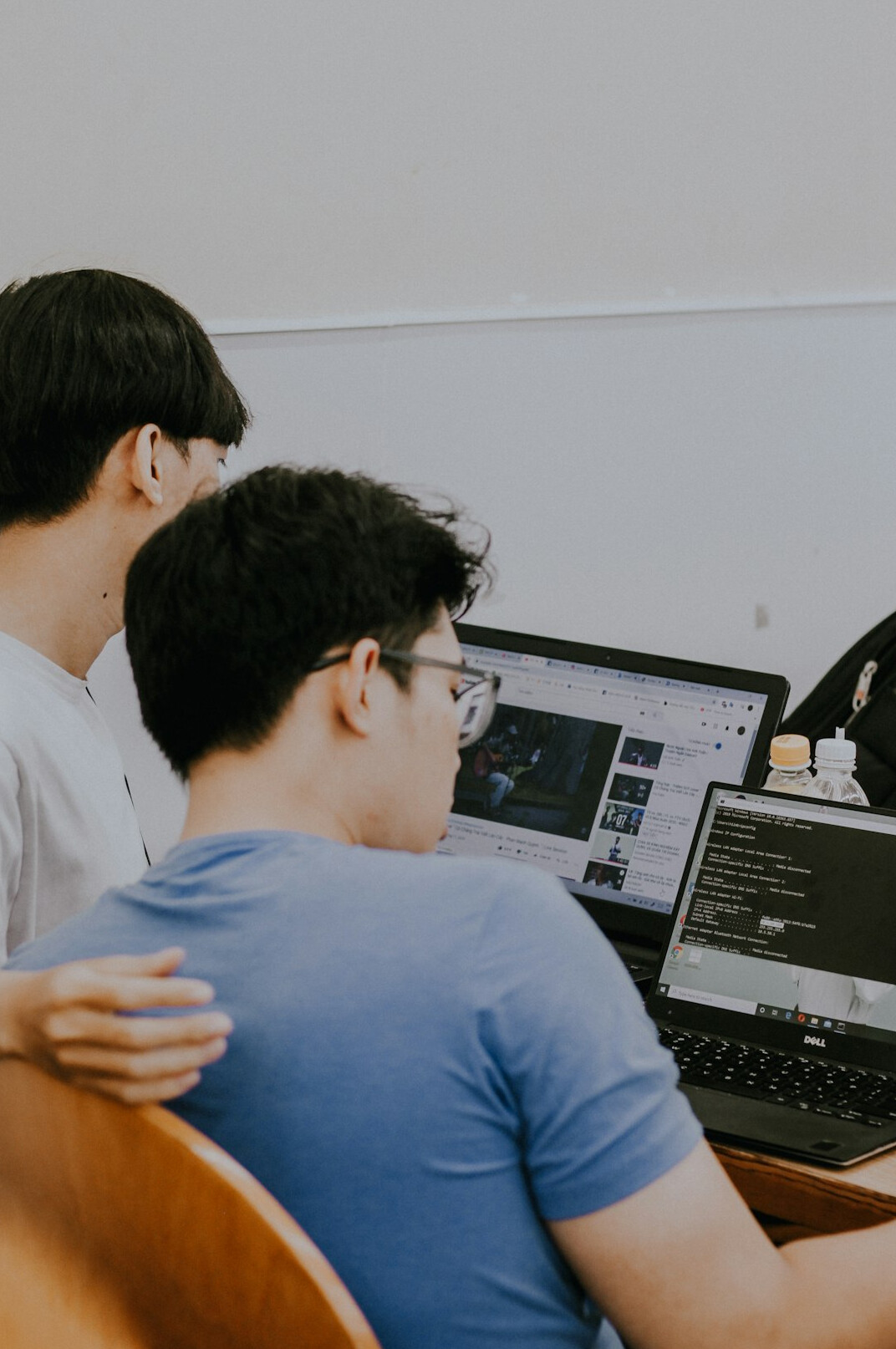 office workers discussing code