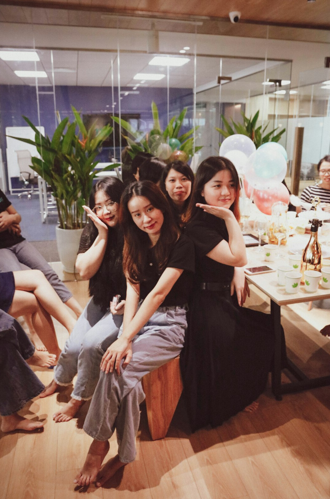 Team of Japanese content writers and editors posing together in an office